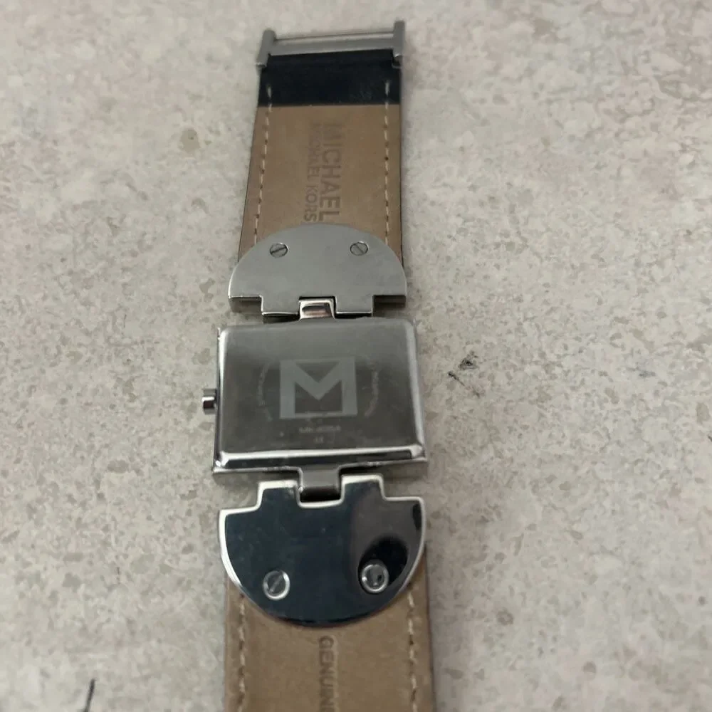 Michael Kors Women’s Rectangle Quartz Watch Silver Dial Black Leather Strap Date